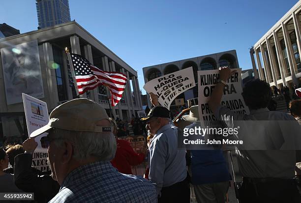 Protesters demonstrate as people arrive for the opening night of the Metropolitan Opera season at Lincoln Center on September 22, 2014 in New York...
