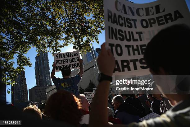 Protesters demonstrate as people arrive for the opening night of the Metropolitan Opera season at Lincoln Center on September 22, 2014 in New York...