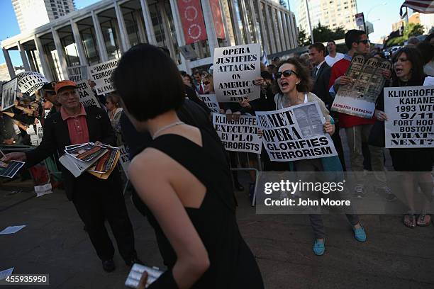 Protesters shout as people arrive for the opening night of the Metropolitan Opera season at Lincoln Center on September 22, 2014 in New York City....