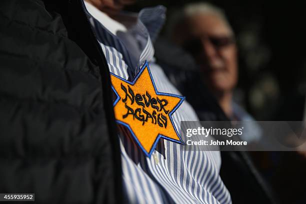 Protesters, many of them Jewish activists, demonstrate as people arrive for the opening night of the Metropolitan Opera season at Lincoln Center on...