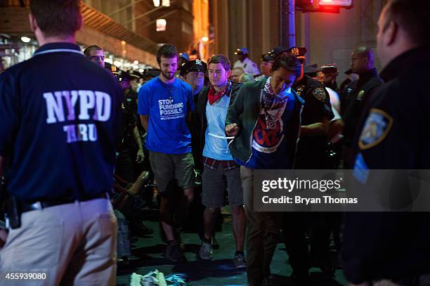 Police officers arrest demonstrators on Broadway following the Flood Wall Street protest after asking them to disperse on September 22, 2014 in New...