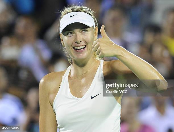 Maria Sharapova of Russia celebrates during her match against Svetlana Kuznetsova of Russia during day two of the 2014 Dongfeng Motor Wuhan Open at...