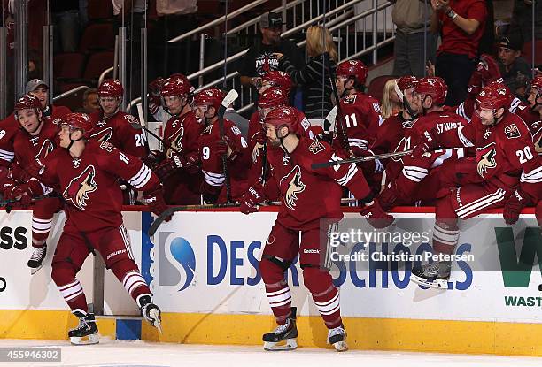 The Arizona Coyotes celebrate off the bench after defeaing the Los Angeles Kings in the preseason NHL game at Gila River Arena on September 22, 2014...