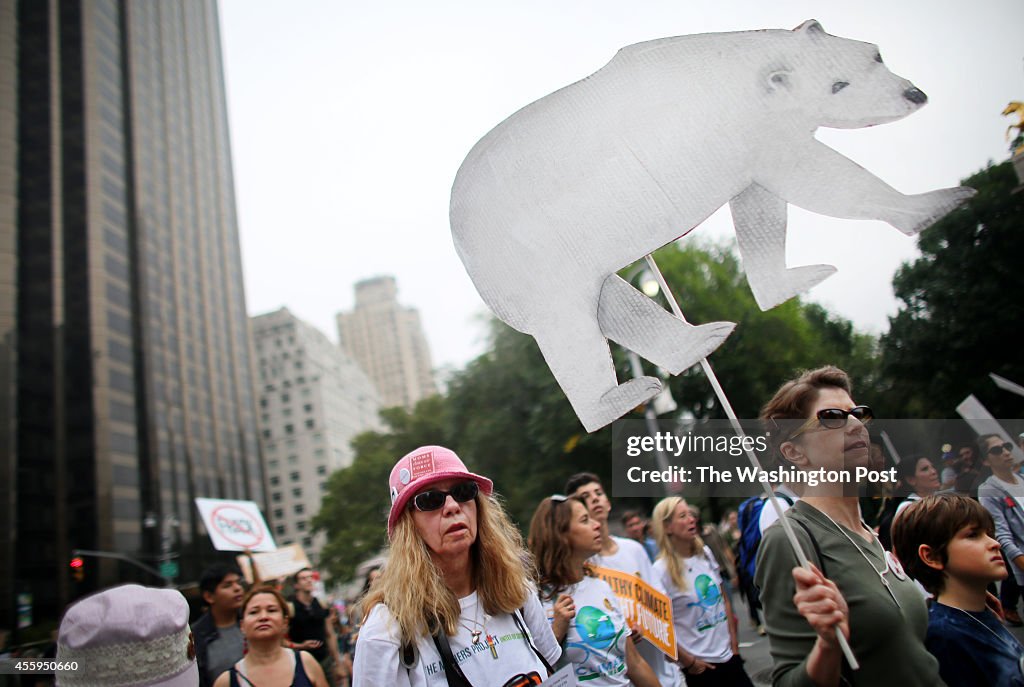 MANHATTAN, NY - SEPTEMBER 21: Activists march through Columbus 