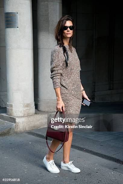 Fashion Blogger Hedvig Opshaug is wearing a Stella McCartney dress, Balenciaga bag, Rayban sunglasses and Common Project trainers on day 4 of London...
