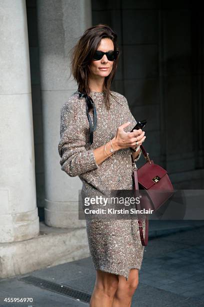 Fashion Blogger Hedvig Opshaug is wearing a Stella McCartney dress, Balenciaga bag, Rayban sunglasses on day 4 of London Collections: Women on...