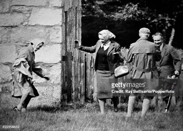 Queen Elizabeth II dancing the "twist" during a picnic in the grounds of Balmoral Castle in Aberdeenshire on 27th August 1962. This image is one of a...