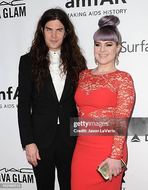 Matthew Mosshart and Kelly Osbourne attend the amfAR Inspiration Gala at Milk Studios on December 12, 2013 in Hollywood, California.