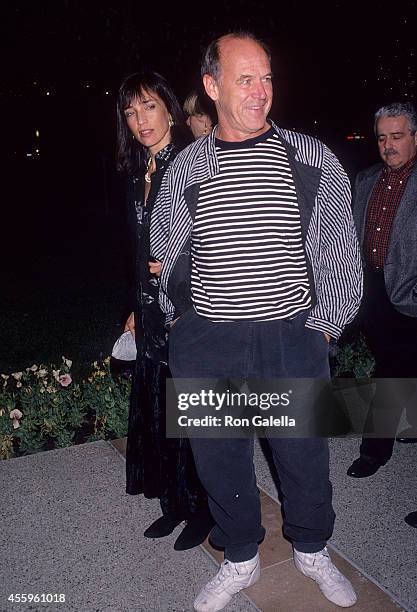 Actor Geoffrey Lewis and date Paula Hochhalter attend the "What's Eating Gilbert Grape" Hollywood Premiere on December 12, 1993 at Paramount Theatre,...