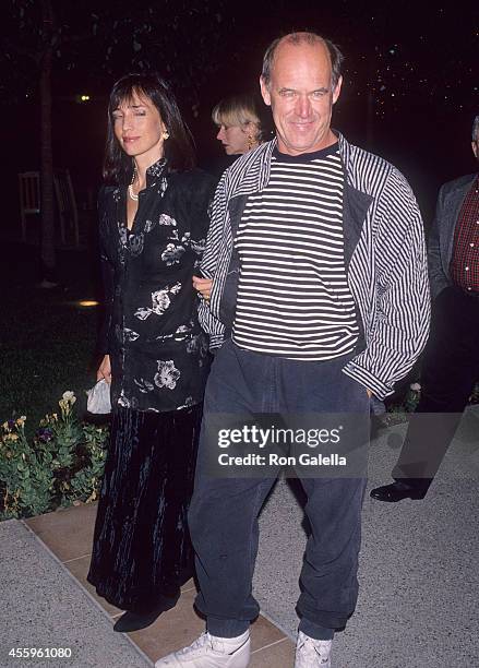 Actor Geoffrey Lewis and date Paula Hochhalter attend the "What's Eating Gilbert Grape" Hollywood Premiere on December 12, 1993 at Paramount Theatre,...