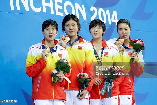 Gold medalist Guo Junjun, Tang yi, Gao Yue And Shen Duo of China celebrate during the medal ceremony after the swimming Women's 4 x 200m Freestyle...
