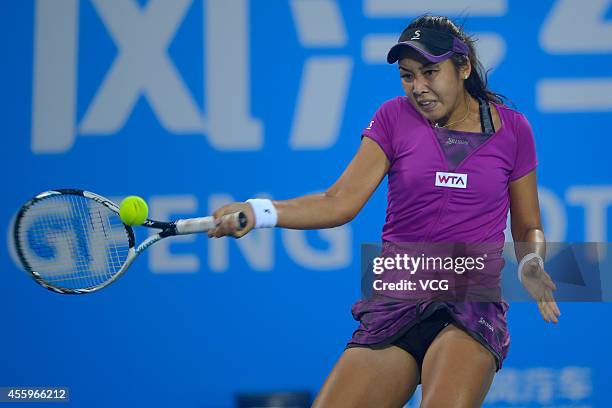 Zarina Diyas of Kazakhstan competes with Angelique Kerber of Germany during day three of the 2014 Dongfeng Motor Wuhan Open at Optics Valley...