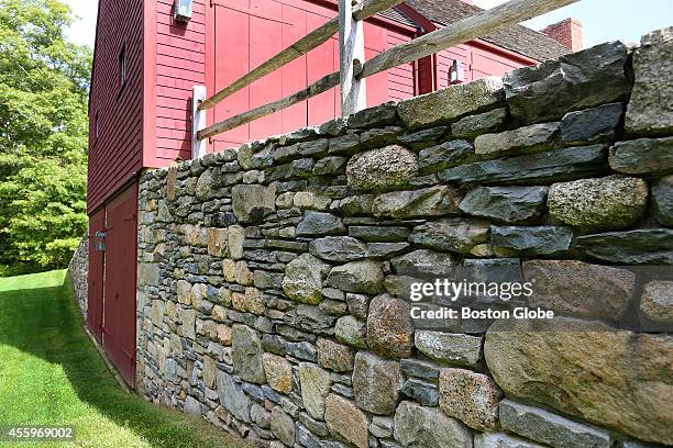 S era home built in Groveland and moved to Mattapoisett. The custom stonework done at the side of the barn creating a retaining wall.