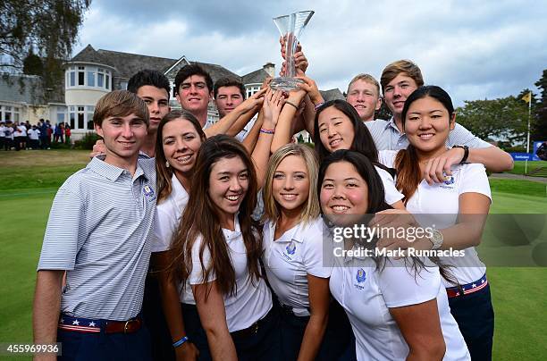 The USA Team pose with Junior Ryder Cup Trophy during the closing ceremony of the 2014 Junior Ryder Cup after beating the European Team 16-8, at...