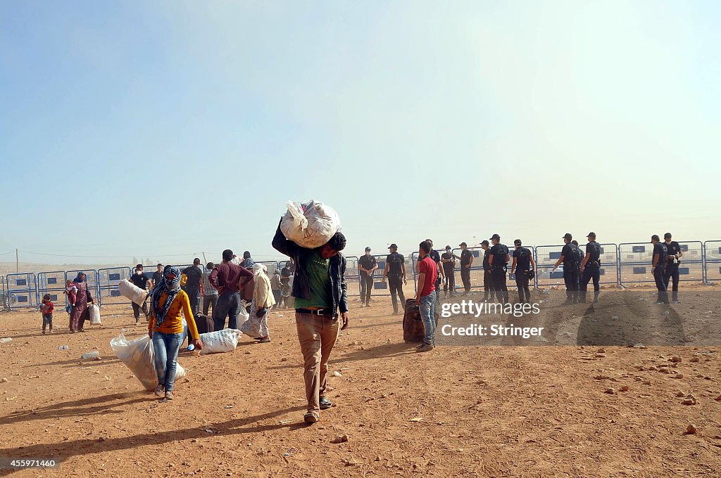 Syrian Kurds Fleeing The Islamic State Militants Cross Into Turkey