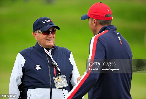 Raymond Floyd, Vice-Captain of the United States talks to Matt Kuchar of the United States during practice ahead of the 2014 Ryder Cup on the PGA...