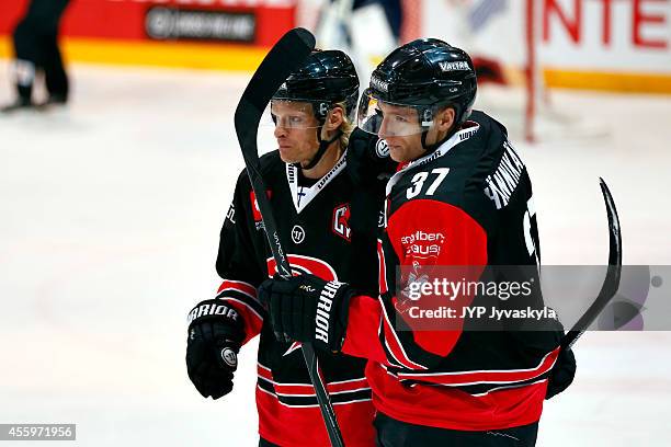 Jani Tuppurainen of JYP celebrates scoring 2-0 with Markus Hannikainen during the Champions Hockey League group stage game between JYP Jyvaskyla and...