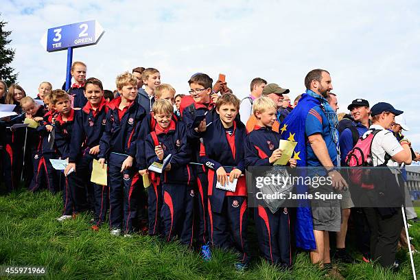 Young golf fans wait for autographs during practice ahead of the 2014 Ryder Cup on the PGA Centenary course at the Gleneagles Hotel on September 23,...