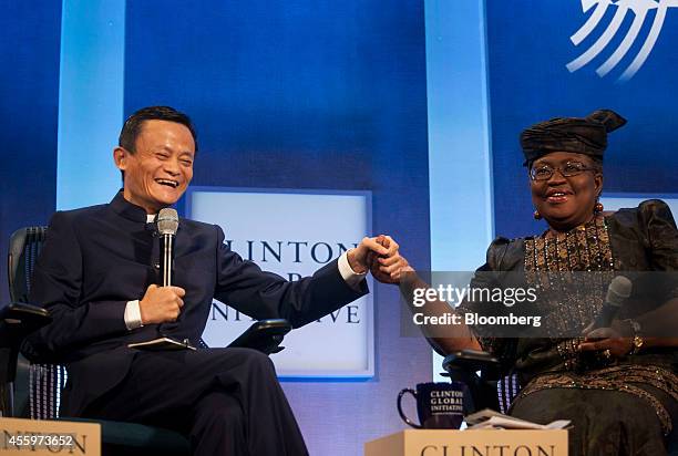 Jack Ma, chairman of Alibaba Group Holding Ltd., left, shakes hands with Ngozi Okonjo-Iweala, coordinating minister of economy and minister of...