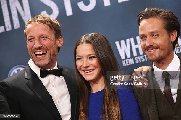 Wotan Wilke Moehring, Hannah Herzsprung and Tom Schilling attend the premiere of the film 'Who am I' at Zoo Palast on September 23, 2014 in Berlin,...