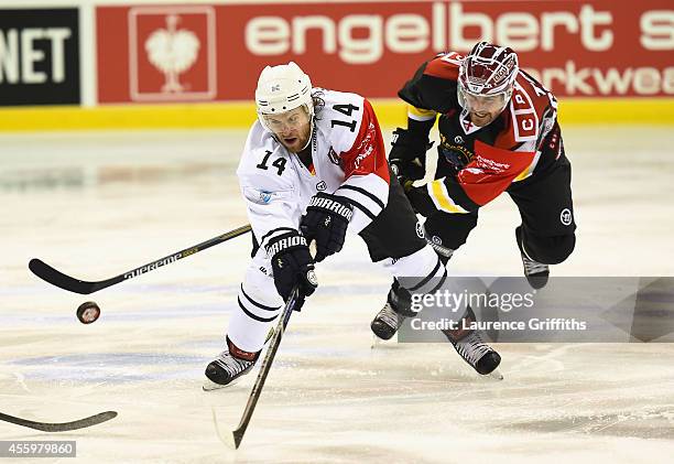 Garrett Festerling of Hamburg Freezers battles with Brandon Benedict of Nottingham Panthers during the Champions Hockey League group stage game...