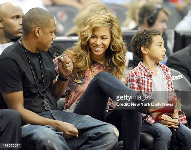 Jay-Z and wife Beyonce watching in the front row during the 1st half of the Nets game against the Detroit Pistons at the Prudential Center.