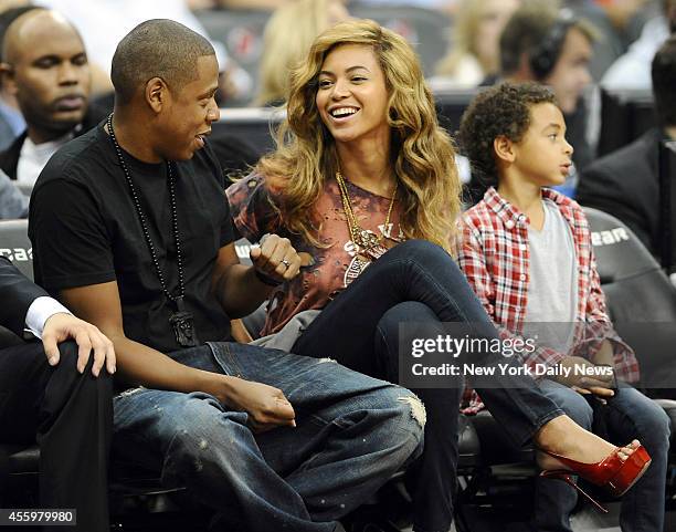 Jay-Z and wife Beyonce watching in the front row during the 1st half of the Nets game against the Detroit Pistons at the Prudential Center.