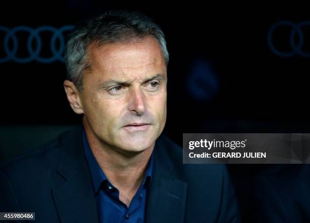 Elche's coach Fran Escriba looks on during the Spanish league football match Real Madrid CF vs Elche CF at the Santiago Bernabeu stadium in Madrid on...