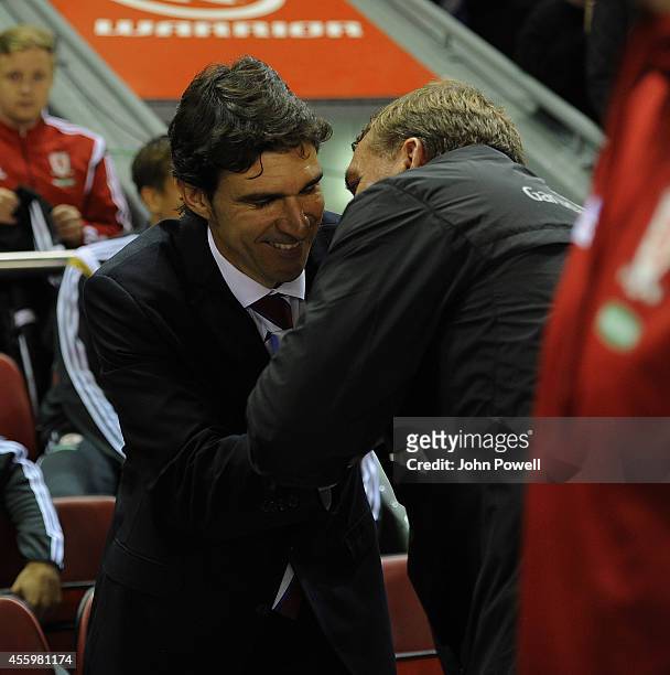 Brendan Rodgers manager of Liverpool shakes hands with Aitor Karanka manager of Middlesbrough before the Capital One Cup Third Round match between...