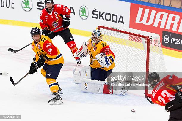 Lucas Wallmark of Lulea Hockey scores against Oskari Setanen Goaltender of Lukko Rauma during the Champions Hockey League group stage game between...