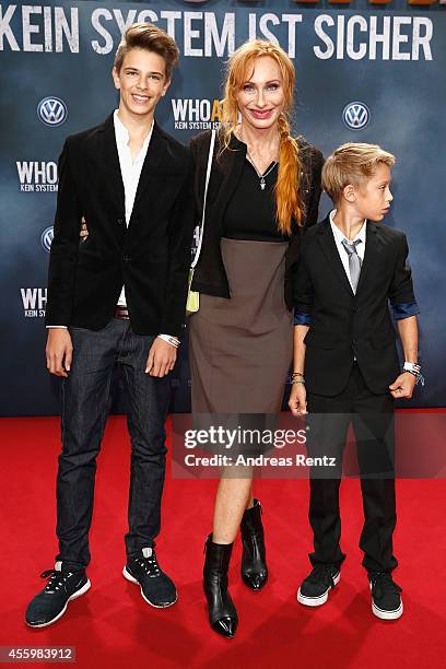 Andrea Sawatzki and her sons Bruno and Moritz attend the premiere of the film 'Who am I' at Zoo Palast on September 23, 2014 in Berlin, Germany.