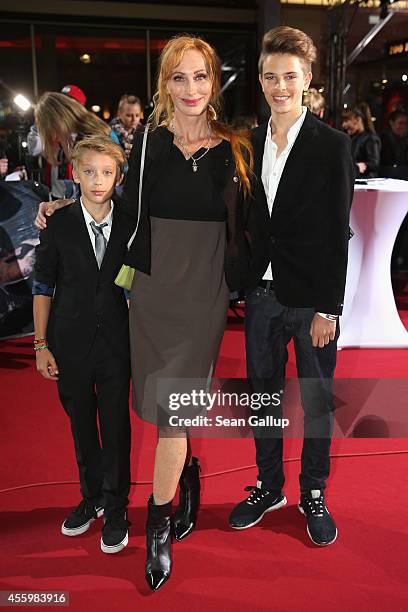 Andrea Sawatzki and her sons Bruno and Moritz attend the premiere of the film 'Who am I' at Zoo Palast on September 23, 2014 in Berlin, Germany.