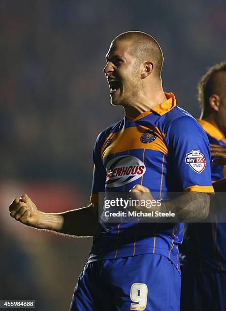 James Collins of Shrewsbury Town celebrates scoreing the opening goal during the Capital One Cup Third Round match between Shrewsbury Town and...