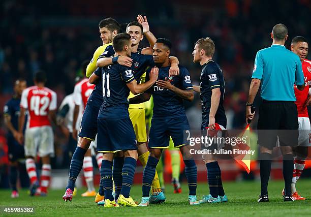 Nathaniel Clyne of Southampton is congratulated at full time after their 2-1 win during the Capital One Cup Third Round match between Arsenal and...