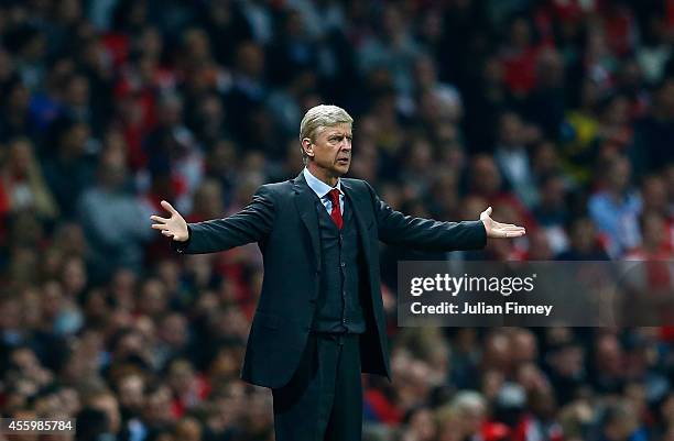 Manager of Arsenal, Arsene Wenger reacts during the Capital One Cup Third Round match between Arsenal and Southampton at the Emirates Stadium on...