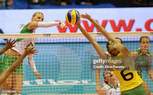 Strashimira Filipova of Bulgaria spikes the ball against to Thaisa Menezes of Brazil during the FIVB Women's World Championship pool B match between...