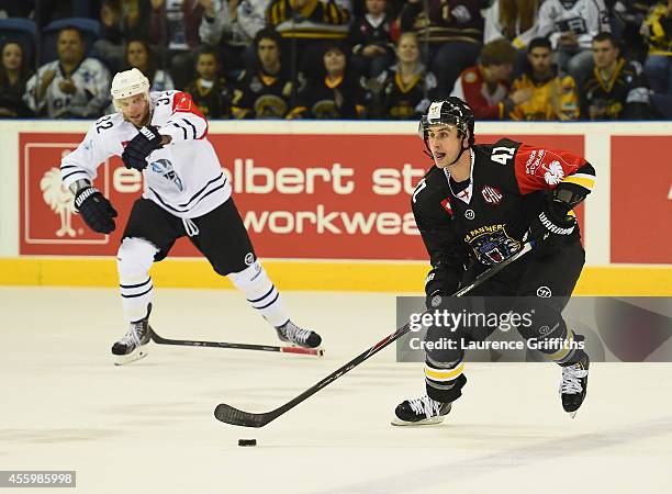Greg Jacina of Nottingham Panthers battles with battles with Kevin Schmidt of Hamburg Freezers during the Champions Hockey League group stage game...