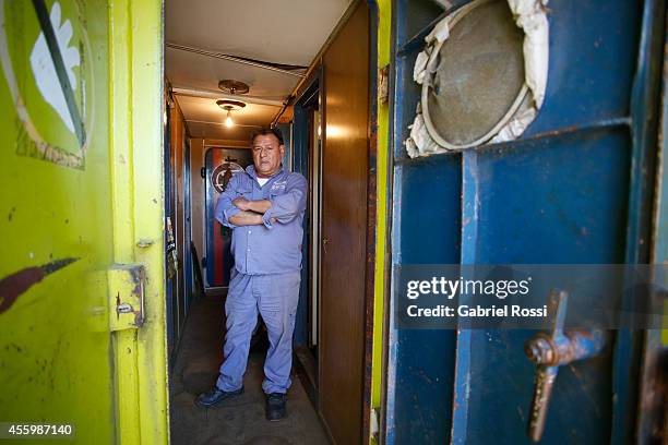 Captain of a dredger belonging to the Port Constructions and Waterways National Department looks on during a working day at Demarchi Island on...