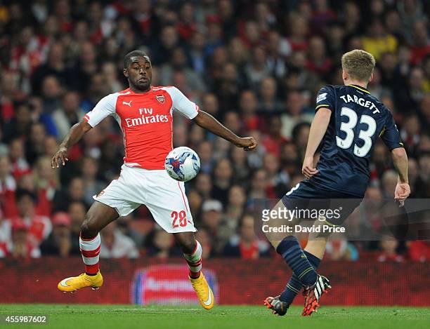 Joel Campbell of Arsenal controls the ball under pressure from Matt Targett of Southampton during the Capital One Cup 3rd match between Arsenal and...