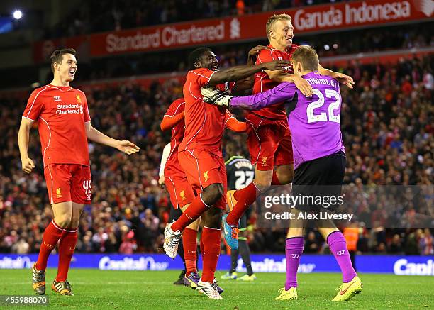 Lucas, Kolo Toure and Simon Mignolet of Liverpool celebrate after winning the match on penalties after a miss from Albert Adomah of Middlesbrough...