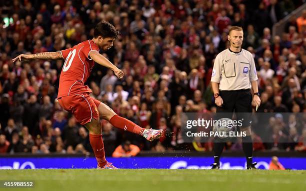 Liverpool's Spanish midfielder Suso scores Liverpool's final penalty during their 14-13 penalty shoot out victory in the English League Cup third...