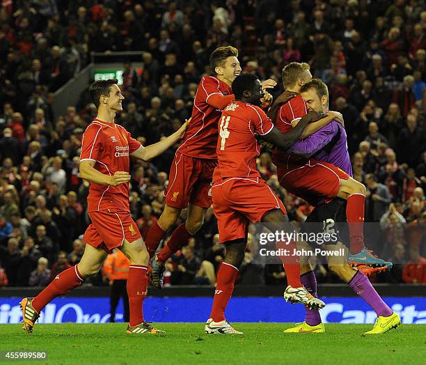 Simon Mignolet and players of Liverpool celebrate their win during the Capital One Cup Third Round match between Liverpool and Middlesbrough at...