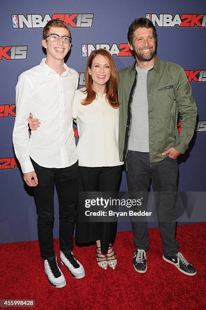 Actress Julianne Moore with husband Bart Freundlich and son Caleb Freundlich attend NBA 2K15 Launch Celebration at The Standard on September 23, 2014...