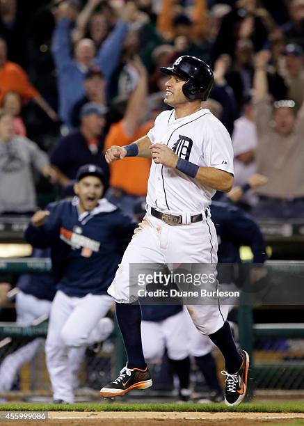 Teammates pour onto the field as Ian Kinsler of the Detroit Tigers scores from second base on a single by Miguel Cabrera to defeat the Chicago White...
