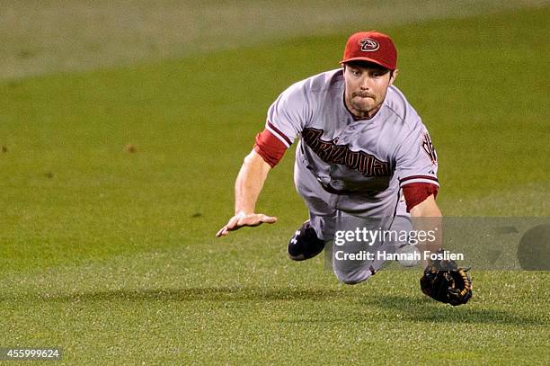 Pollock of the Arizona Diamondbacks misses a ball off the bat of Eduardo Nunez of the Minnesota Twins that went for a double in the fourth inning of...