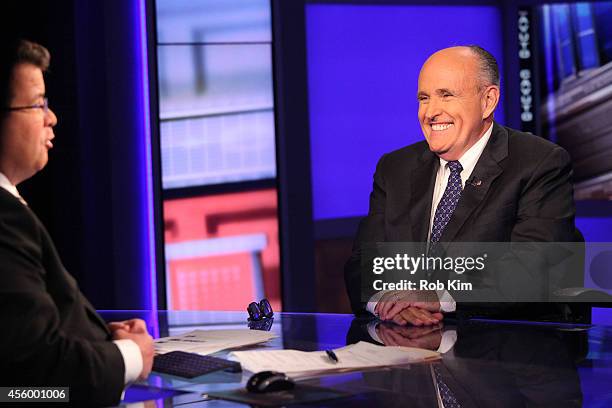 Rudy Giuliani talks with host Neil Cavuto on the set of "Cavuto" on FOX Business Network at FOX Studios on September 23, 2014 in New York City.