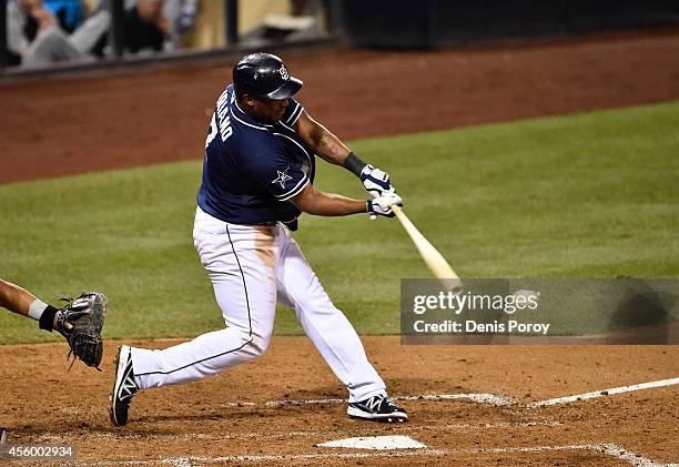 Rymer Liriano of the San Diego Padres hits an RBI single during the sixth inning of a baseball game against the Colorado Rockies at Petco Park...