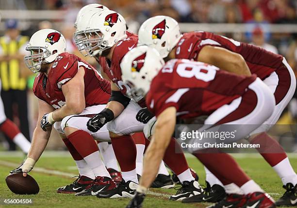 Center Lyle Sendlein of the Arizona Cardinals prepares to snap the football during the NFL game against the San Diego Chargers at the University of...