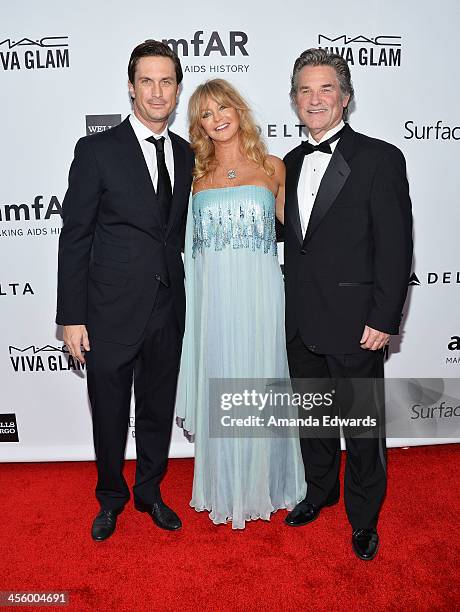 Actors Oliver Hudson, Goldie Hawn and Kurt Russell arrive at amfAR The Foundation for AIDS 4th Annual Inspiration Gala at Milk Studios on December...
