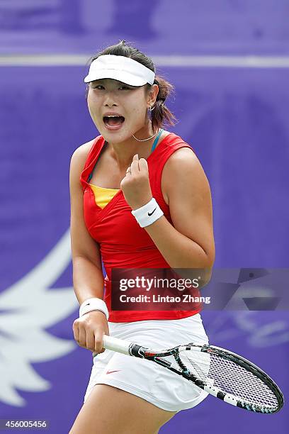 Duan Yingying of China celebrates a point during the Women's Team Gold Medal Match against Chan Yung Jan of Chinese Taibei on day five of the 2014...